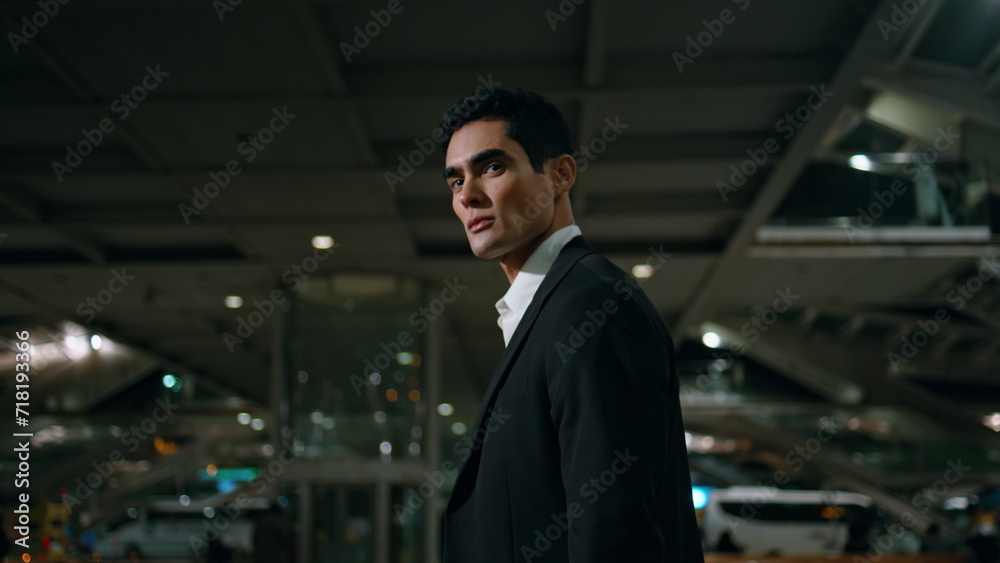 Serious man going night lights street portrait. Formal suit manager walking city Serious man going night lights street portrait. Formal suit manager walking city