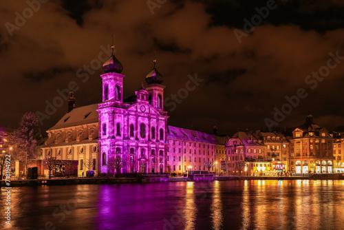 The Jesuit church in Swiss city Lucerne is illuminated in lila color during the light show festival in the evening
