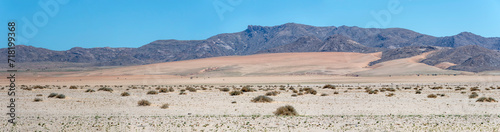 Obraz na płótnie mountain range and colorful sand slopes in Naukluft desert, near Garub, Namibia w salonie