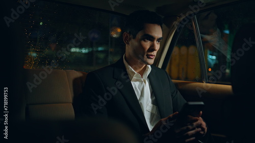 Rich man calling smartphone in business car closeup. Director making work call © stockbusters