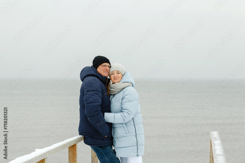 Portrait of a happy elderly couple by the sea.