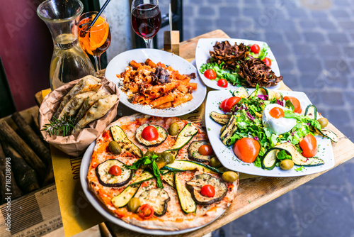 Travel in Italy, Part of Italian culture - healthy mediterranean italian food. Rome street restaurants with variety of typical pasta, pizza and salads