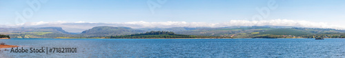 Lake Furnas during a beautiful sunny day, with a view of the Serra da Canastra in the background. Panoramic view of Lake Furnas, in the interior of Minas Gerais, Brazil.