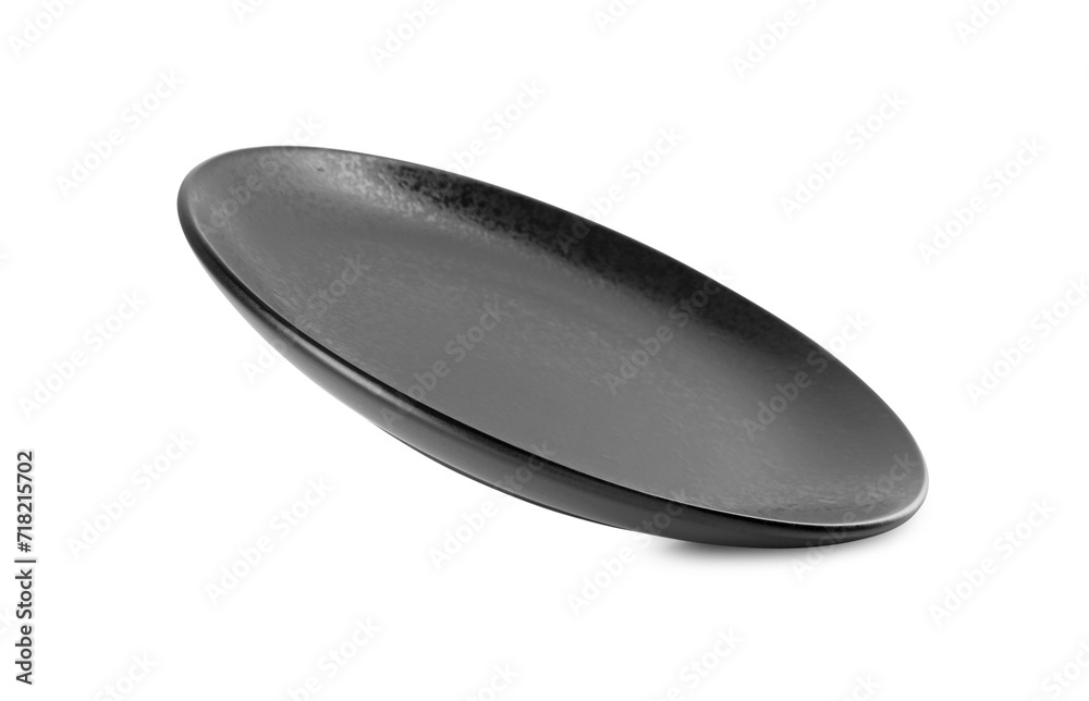 One beautiful black plate isolated on white One beautiful black plate isolated on white