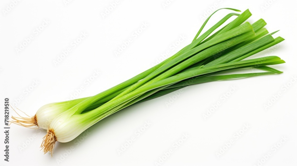 vibrant green of fresh spring onions on a white wooden table.