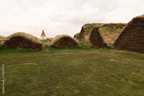 The Glaumbaer turf farm is a historical site and museum in North Iceland's Skagafjordur fjord photo