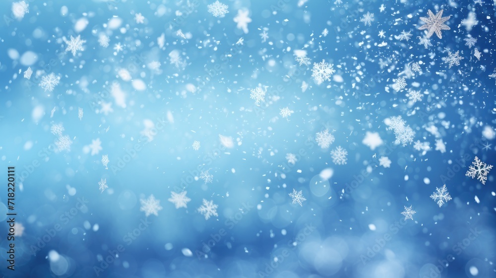 Falling snowflakes and Bokeh with white snow on a blue background