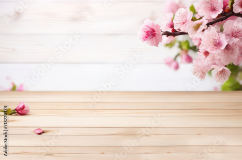 wooden table top with pink spring flowers