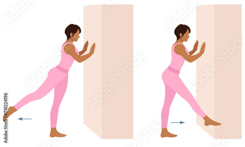 A woman does exercises near the wall. Wall Pilates.