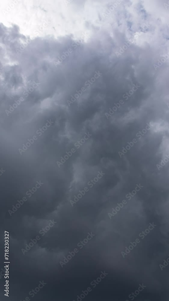 Vertical video - Timelapse of dark ominous storm clouds forming and dissolving Vertical video - Timelapse of dark ominous storm clouds forming and dissolving