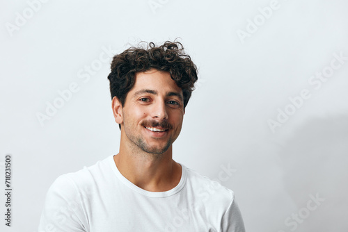 Hipster man isolated fashion background white t-shirt portrait smile © SHOTPRIME STUDIO