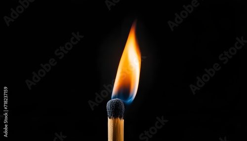burning match on black background - close up view. Burning match isolated on black background. Creative illustration.