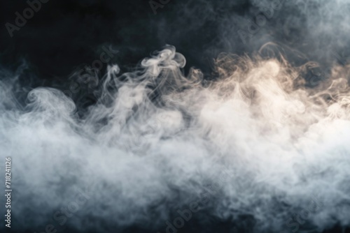 Smoke captured in a close-up shot against a black background. This image can be used to create a mysterious or dramatic atmosphere