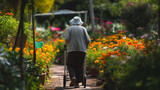 Senior woman walking in garden with lots of spring flowers blooming. Mature female pensioner at the garden centre
