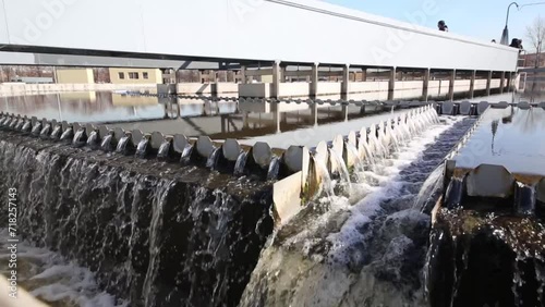 Wastewater flows through chute of settler in wastewater treatment plants
