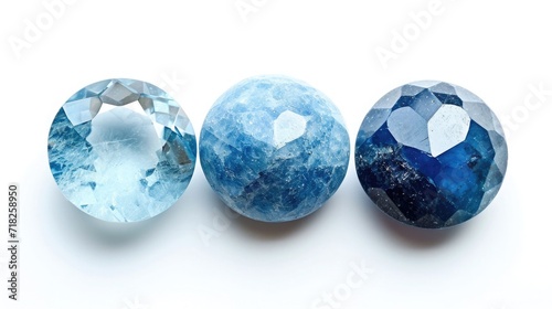 Three identical-sized gemstones, Aquamarine, Blue Topaz, and Lapis Lazuli, neatly placed next to each other, each radiating their serene blue colors, on a white background