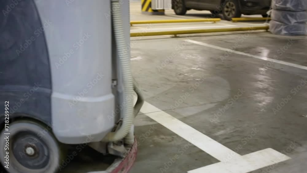 Working modern washing car in underground parking of residential complex Working modern washing car in underground parking of residential complex