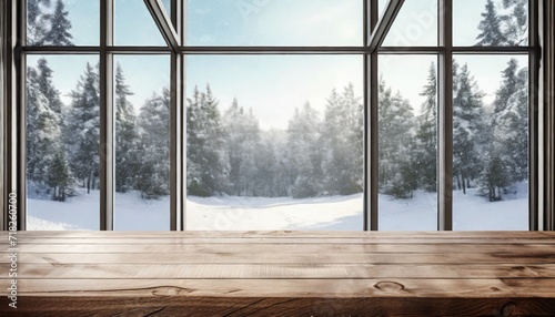 empty wooden table with a modern large glass window in a snow covered forest in the background with copy space blank for text ads and graphic design