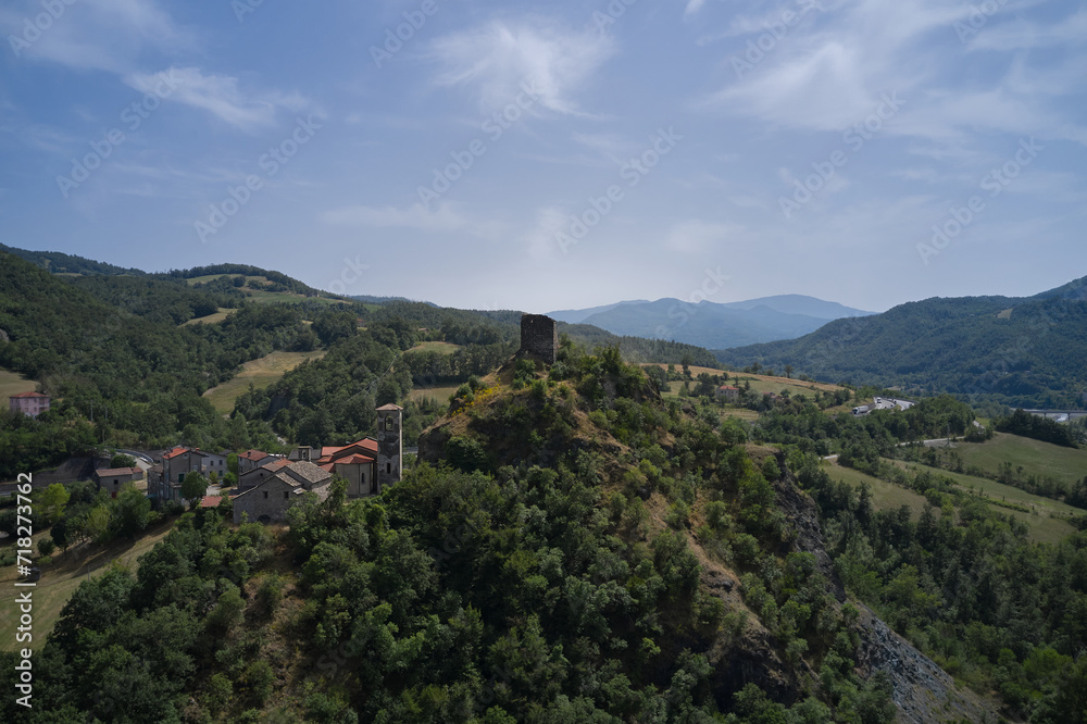 Italy's charm unfolds: Castello di Pietramogolana and Viadotto Rio Pietramogolana in a stunning drone panorama. Explore the beauty of Pietramogolana PR.