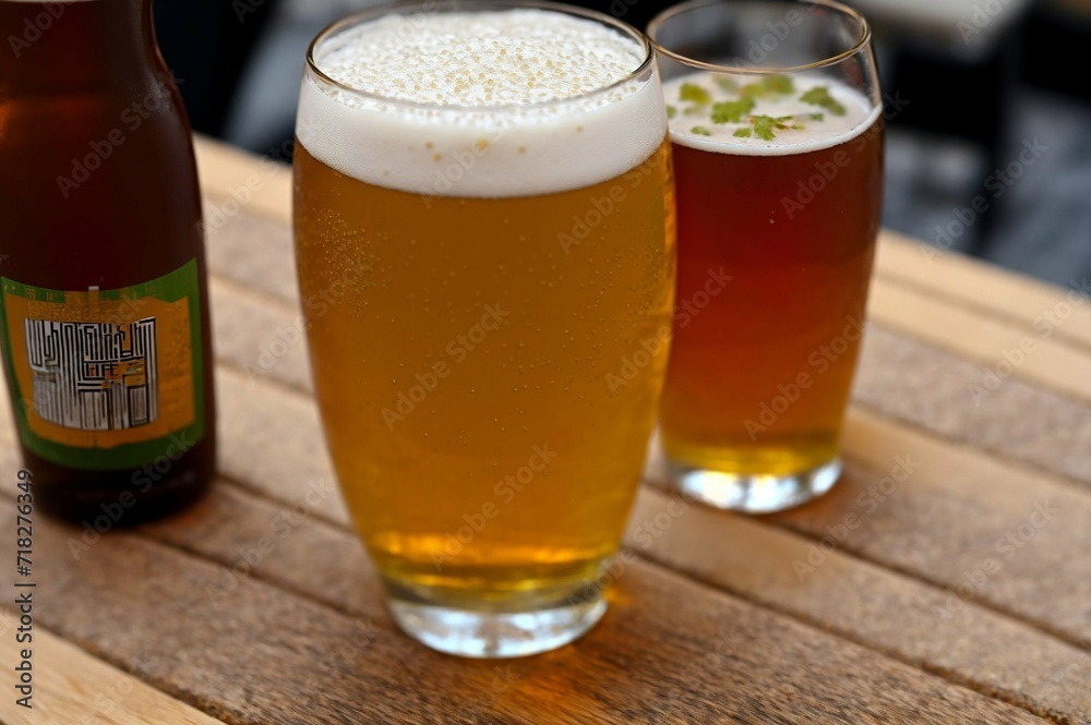 Glass of beer with steamed rice and parsley on wooden board Glass of beer with steamed rice and parsley on wooden board