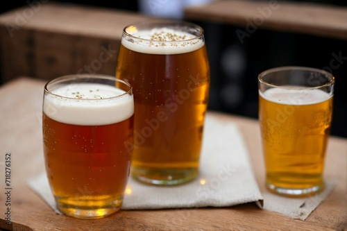 Glass of beer with steamed rice and parsley on wooden board