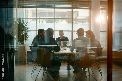 people sitting around a table at a conference room