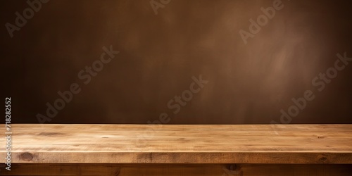 An empty wooden table on a brown background, perfect for displaying products.