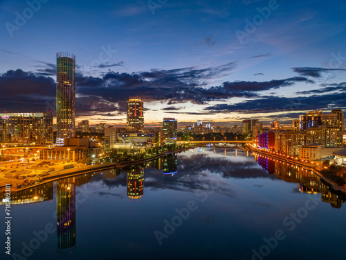 Yekaterinburg city and pond aerial panoramic view at summer or early autumn night. Night city in the early autumn or summer.