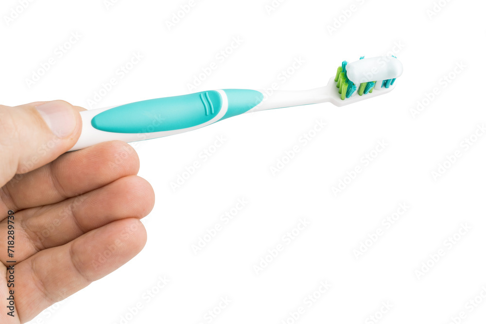 Hand holding toothbrush with toothpaste, isolated on white background Hand holding toothbrush with toothpaste, isolated on white background