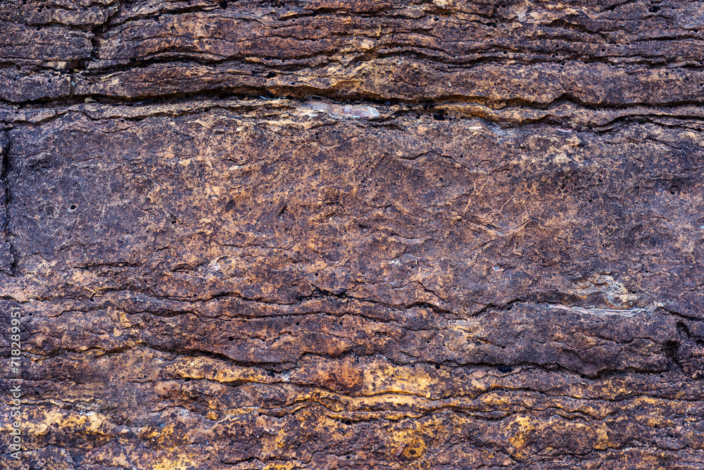 Dark brown old stone surface textured background Dark brown old stone surface textured background