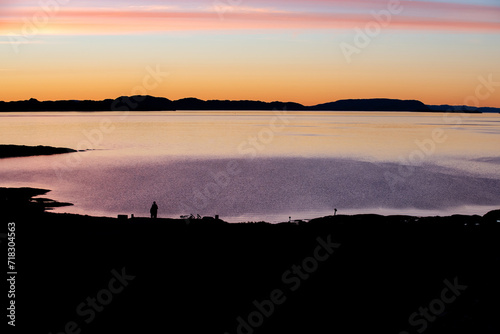Fototapeta Naklejka Na Ścianę i Meble -  Beautiful deep red sunset with silhouettes of mountains, overlooking the sea.