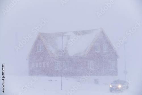 Old building with heavy Snow Storm, Blizzard, in the Arctic - Nuuk, Greenland