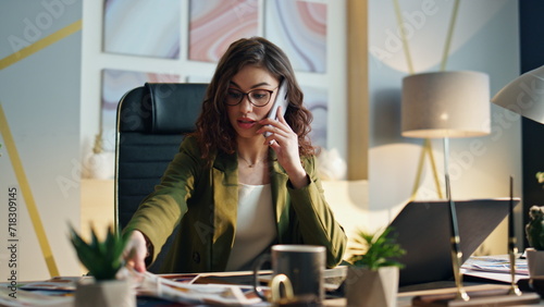 Nervous executive manager calling phone at office closeup. Stressed girl talking