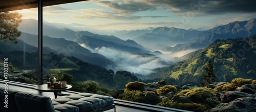large windows with beautiful views of misty hills and sunsets