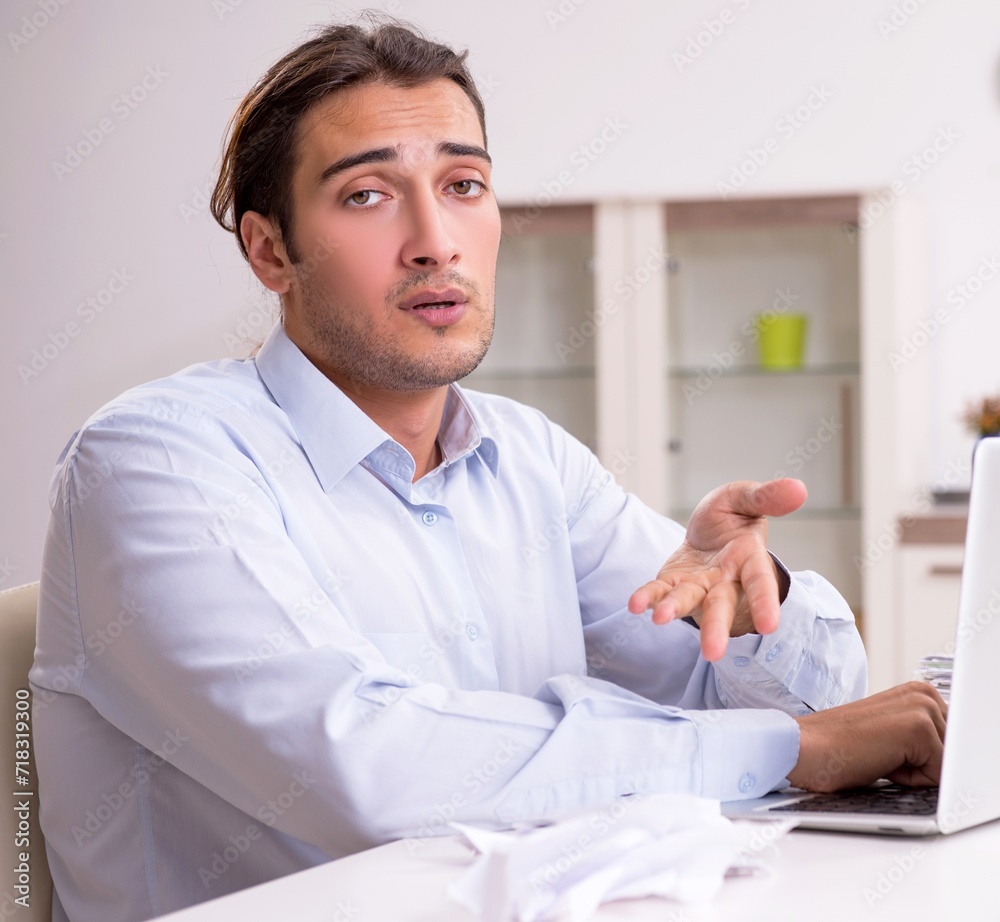 Young male businessman working at home Young male businessman working at home