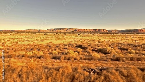 Desert Country.  The view from a train as it crosses desert between Gallup and Grants in New Mexico in the United States of America.