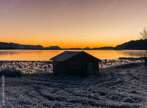 Boat house with a sunset background © Jonar Kristensen