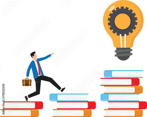 Businessman climbs on a stack of books to knowledge. Education and professional career concept.
