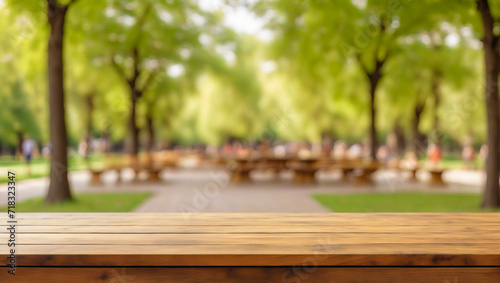 An empty wooden plane table on a blurred background of a city park on a summer day