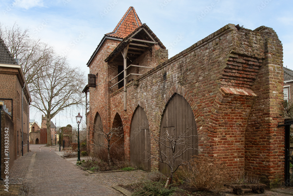 Medieval city wall with defense tower in the city of Zutphen.