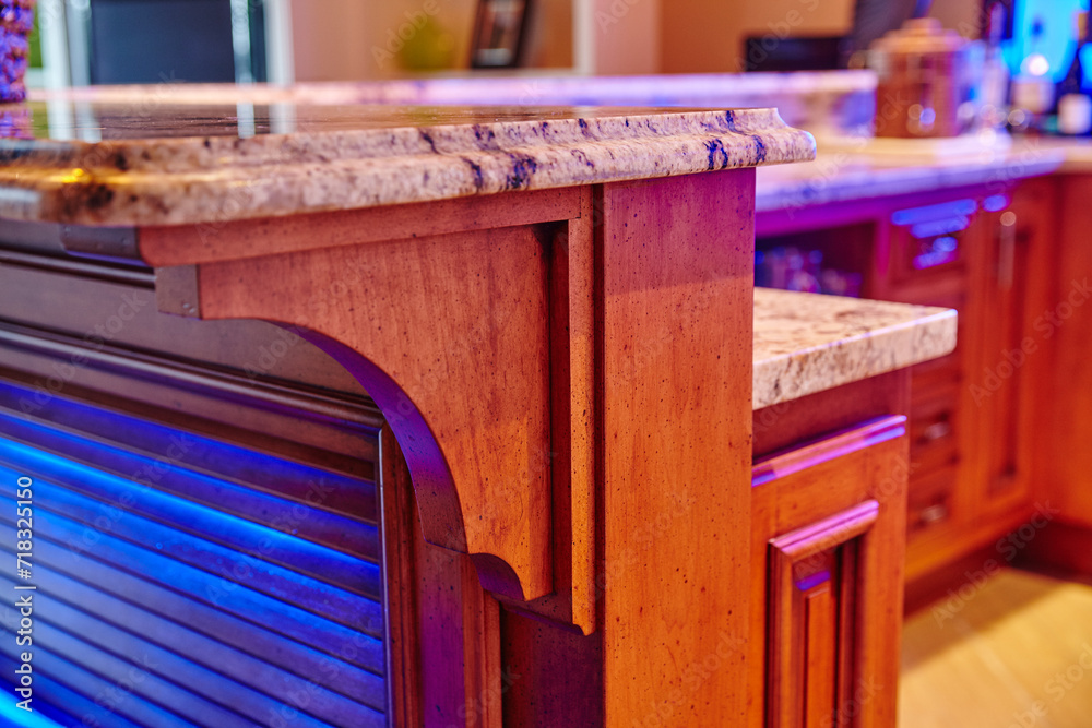 Luxurious Kitchen Island Design with Blue Accent Lighting