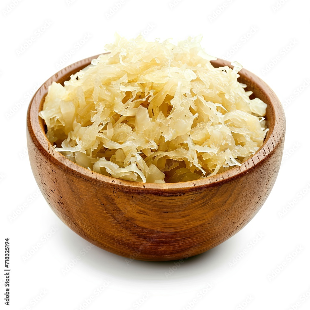 Sauerkraut in a wooden bowl isolated on white Sauerkraut in a wooden bowl isolated on white