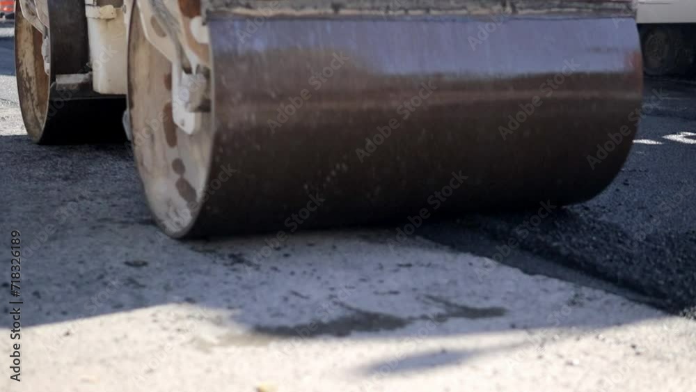 Road roller. The skating rink passes along the road. Road repair. Asphalt road. Close-up Road roller. The skating rink passes along the road. Road repair. Asphalt road. Close-up