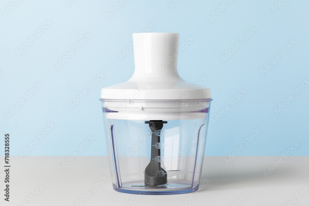 Electric hand blender on blue background. Top view. Electric hand blender on blue background. Top view.
