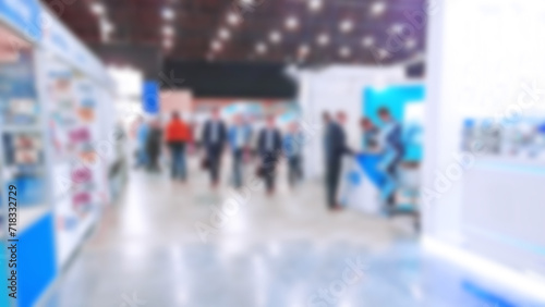 Abstract blur people on trade show background. New modern exhibition, convention and conference expo centre. Venue for holding business. Financial and economic growth and crisis concept. Collaboration photo