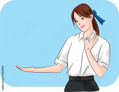 The young Asian student with uniform standing to presenting on the blue background. 