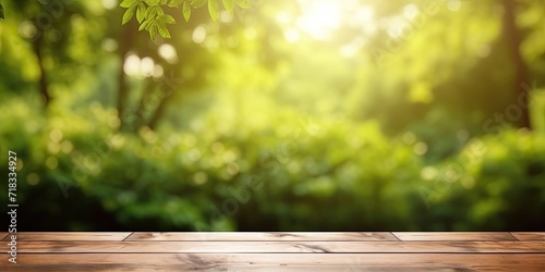 Blurred nature backdrop with wooden tabletop