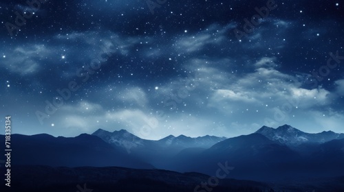  the night sky is full of stars and the mountains are silhouetted against the night sky with clouds and stars.