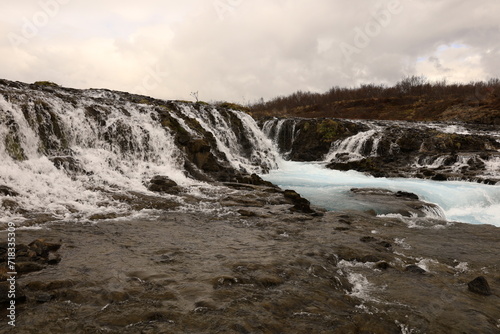 Fototapeta Naklejka Na Ścianę i Meble -  Bruararfoss is a waterfall in West Iceland which runs by the boundaries of municipalities Biskupstungur and Grímsnes