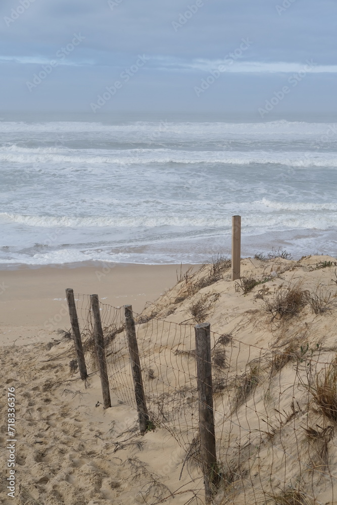 The beach of Cap Ferret on a foggy day. Cap Ferret, France - January 23, 2024. The beach of Cap Ferret on a foggy day. Cap Ferret, France - January 23, 2024.